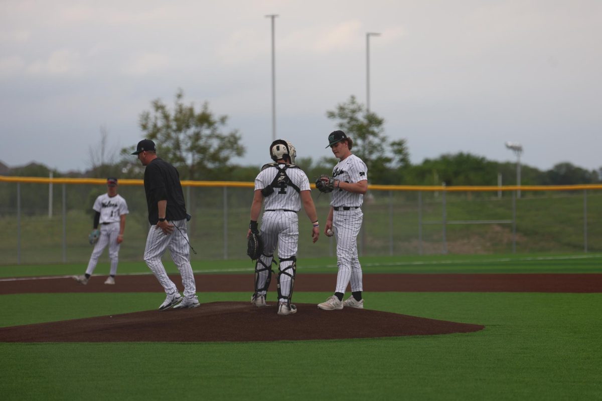 During the game on May 6 against BVNW, senior Drew Jakubielski went to the mound to talk to his teammate junior Chase Minton.