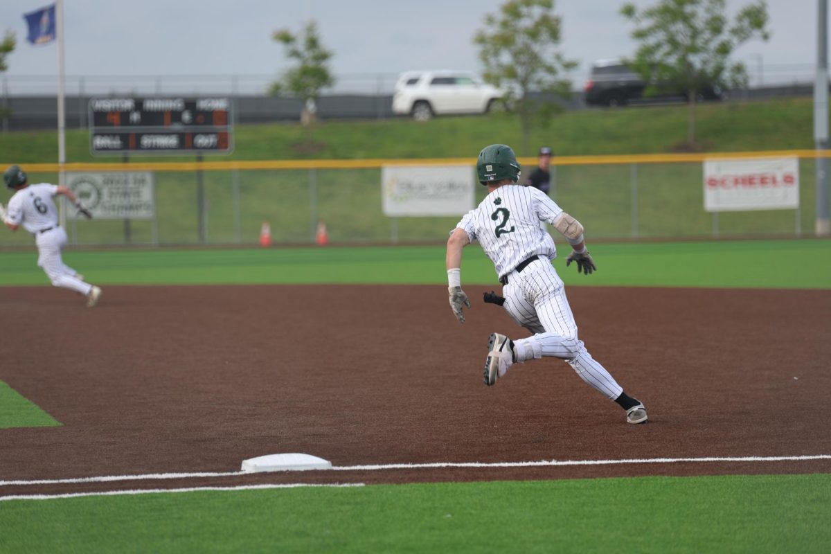 On May 6, junior Brody Shinkle runs to second base during the game against BVNW on May 6. 