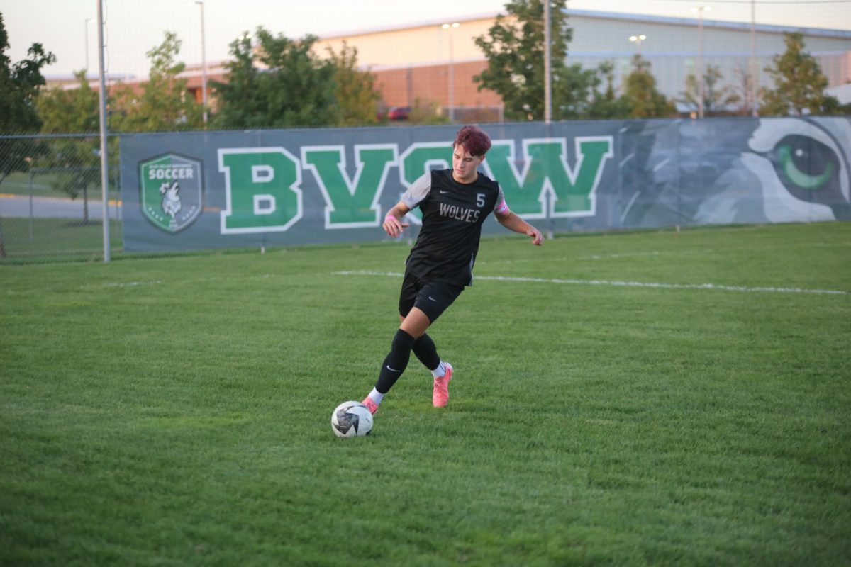 Senior Jarrett Pechar chases the ball to get it back to his team at his soccer match on Oct. 1.