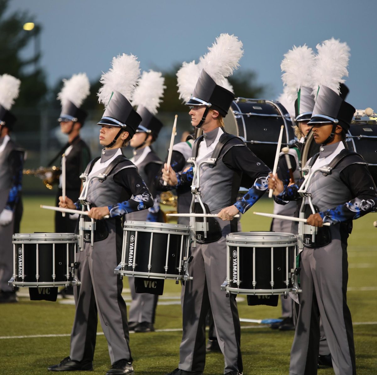 Sophomore Logan Shaddox and seniors Wes Harvell and Nischal Kayastha march in the band's showcase on Sept. 30. 