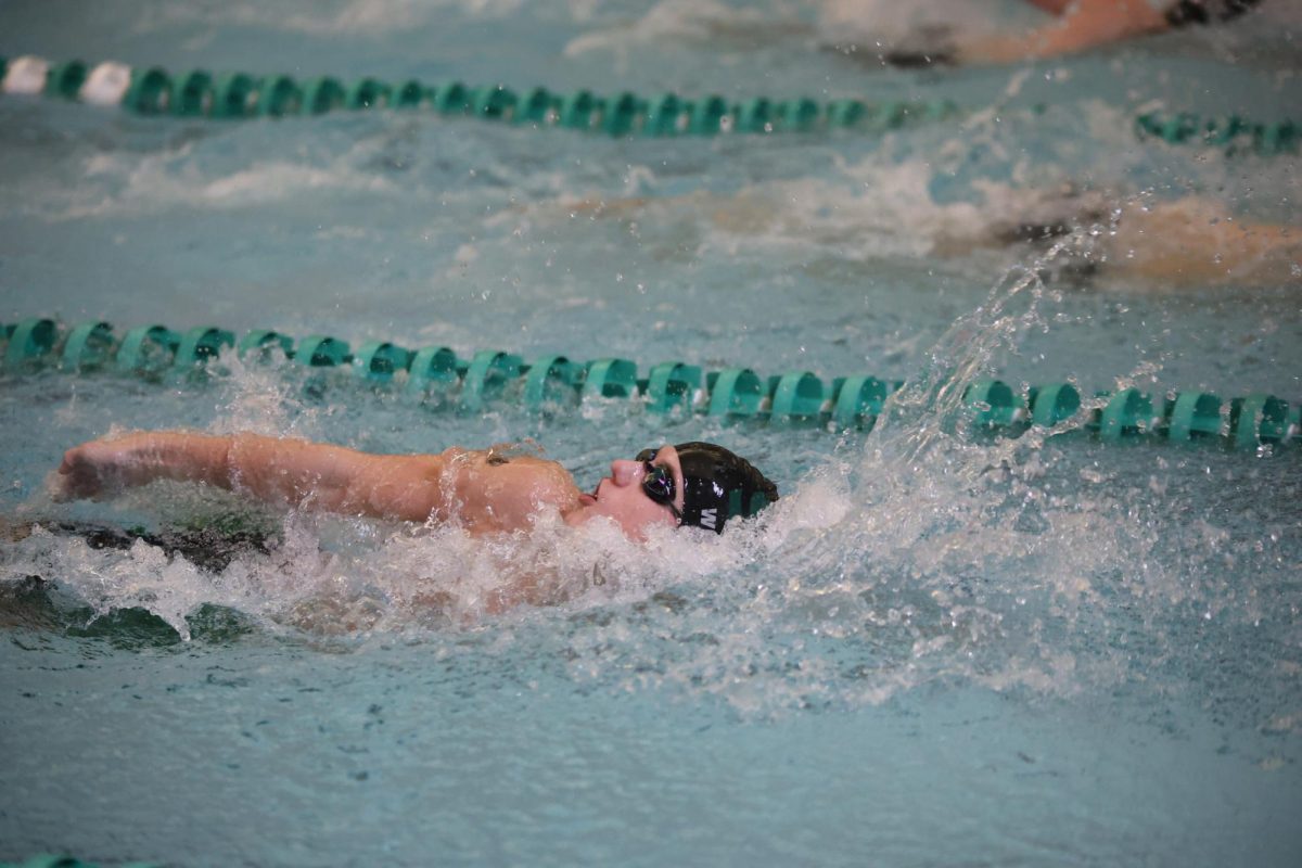 Junior Dane Weninger breaks two swim records